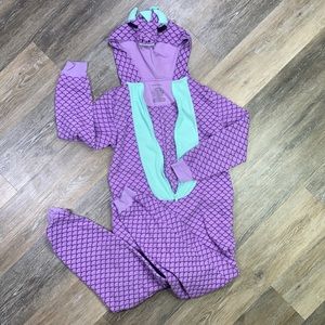 Woman’s purple and minty blue dragon onesie